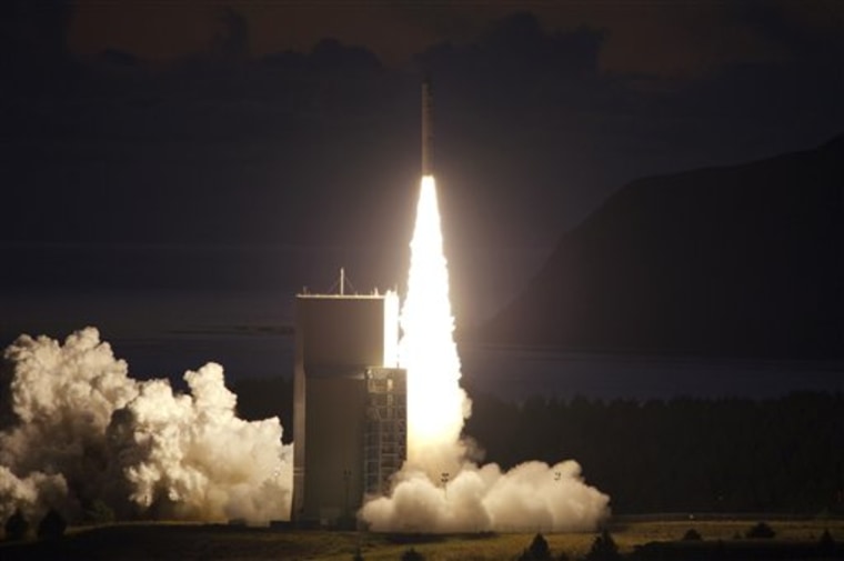 A rocket lifts off from the Alaskan Aerospace Corp.'s Kodiak Launch Complex in Alaska on Tuesday, carrying an experimental Navy communications satellite designed for safer combat communications.
